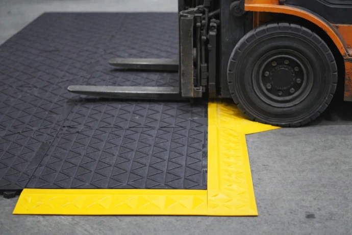 Rebourne H7 anti-fatigue mat with a forklift driving onto it