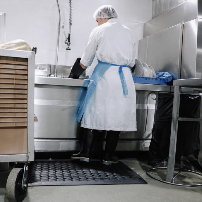 Rebourne F2 antimicrobial anti-fatigue mat in a restaurant