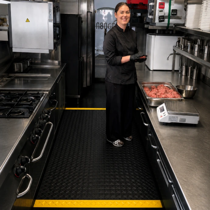Rebourne H8 antimicrobial anti-fatigue mat in a commercial kitchen