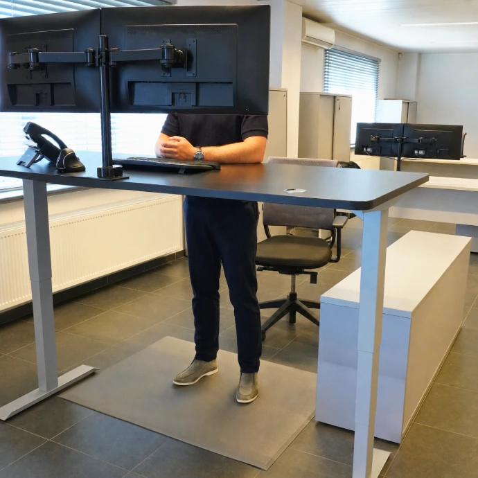 Office working standing on Rebourne W1